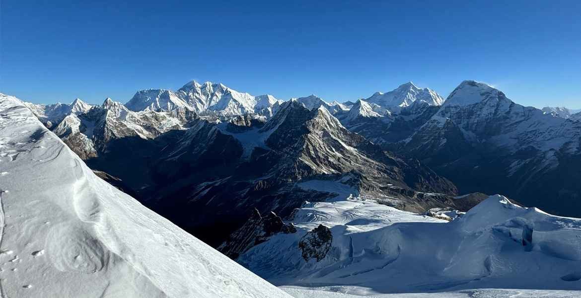 everest, makalu, lhotse, and nuptse with other high peaks views from the summit of mera peak with the blue sky on a clear day.